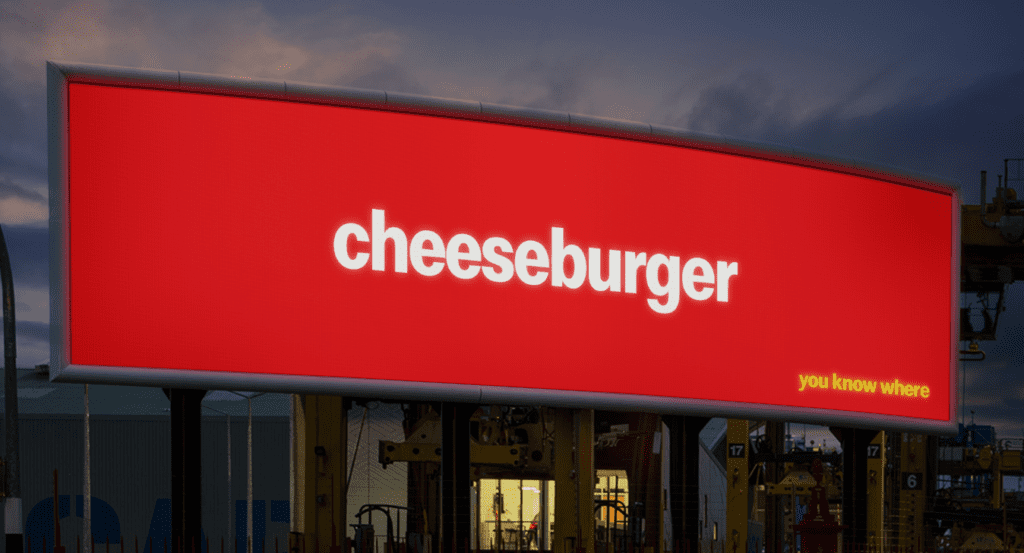 Macdonalds billboard that reads: cheesburger. You know where.