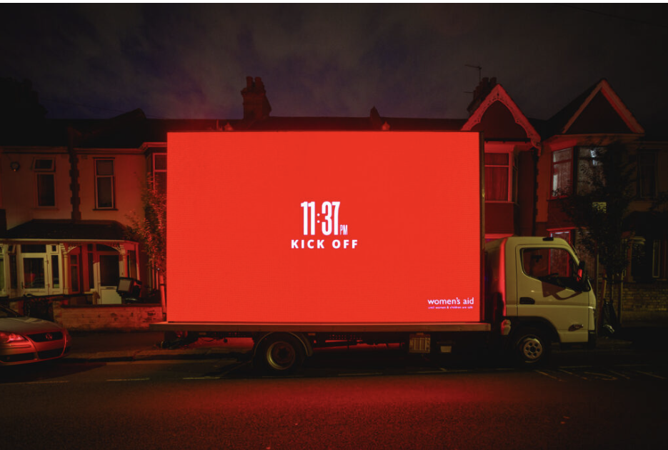 The Woman's Aid 11:37 campaign creative on the side of a truck