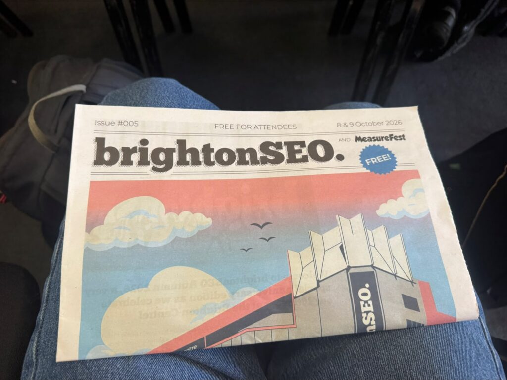 The BrightonSEO newspaper on an attendee's lap