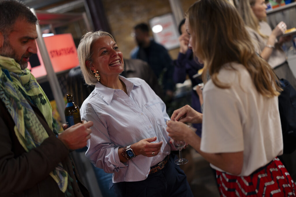 Attendees chat at the event