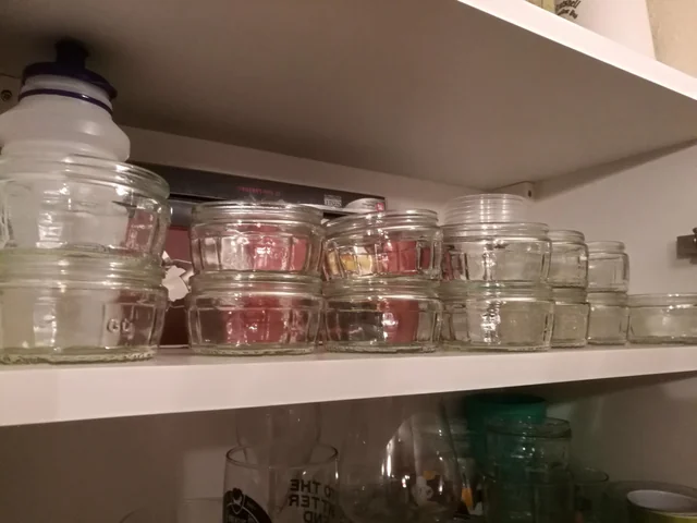 a cupboard full of ramekins